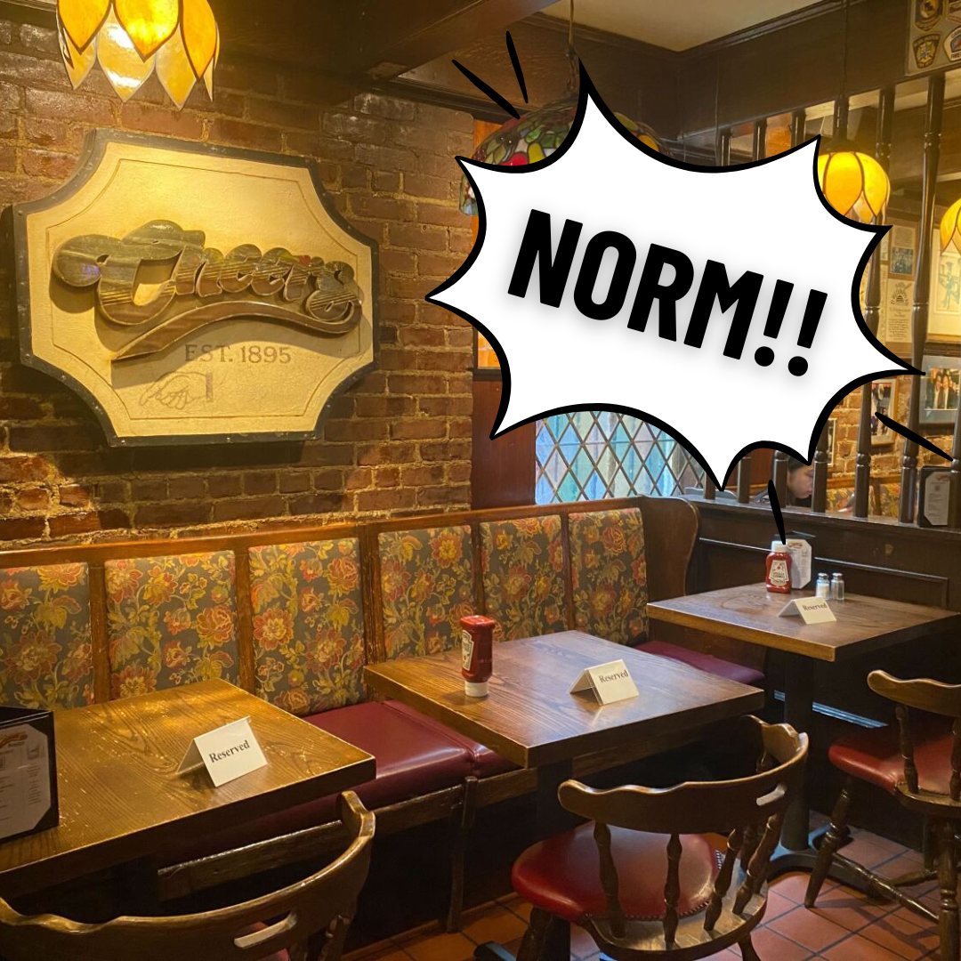 Image of the Cheers bar in Boston with a speech bubble showing the scream of "Norm" as the regular customer Norm enters the bar.