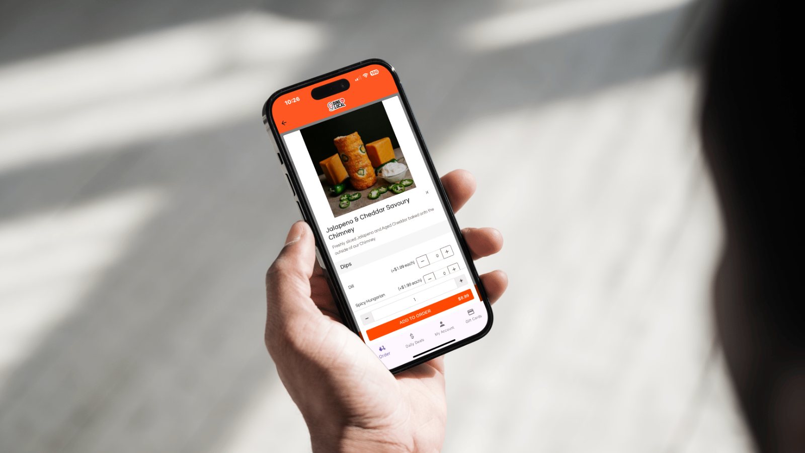 A photo of a user browsing a unique menu item using the Dine Local App for ordering of takeout and delivery from a local independent restaurant.